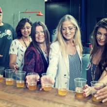 Tour guests sample AIB Beer