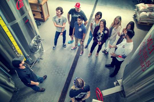 Brewmaster Jesse Robles with tour guests